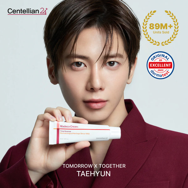Person holding a tube of Centellian2+ Madeca Cream with brand logos and text on a light gray background
